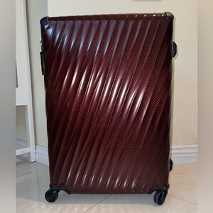 Stylish Burgundy Tumi Suitcase with Wheels